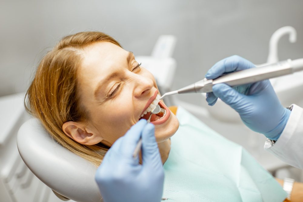 woman-during-a-teeth-inspection-at-the-dental-office-e1754635874178.jpg